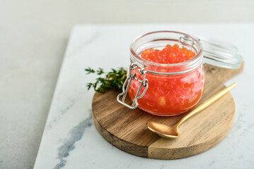 Red caviar in the glass jar