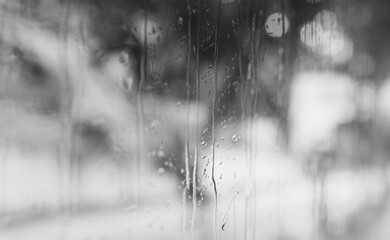 Wet window. Black and white toned image 