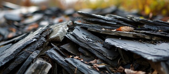 Old slate neatly piled with debris from old buildings.