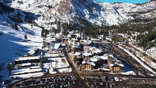 Aerial View of Olympic Village, Palisades, Lake Tahoe, California USA. Famous Ski Resort on Sunny Winter Day