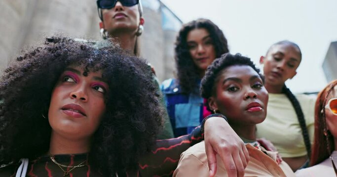 Face, diversity or friends with fashion in city on holiday vacation with low angle, streetwear or swag. Group of people, women or trendy stylish urban clothes with confidence, pride or youth culture