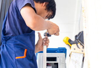 Technicians man cut joint with the tool of copper pipe system air conditioner, Air conditioning technicians install new air conditioners in homes, Repairman fix air conditioning systems