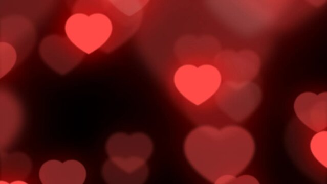 4K looped animated video. Glowing neon beating red hearts of different sizes fly up on dark black background. Loop animation for Happy Valentine's Day. Concept of holiday of relationship, love, party