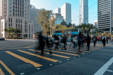 Busy city street people on zebra crossing at Hong Kong