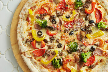 pizza with salami and vegetables