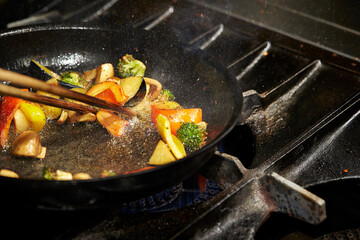 frying pan with meat and vegetables