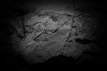 Weathered stone background. Black and white rock surface texture.