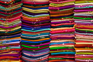 Stacks of colorful fabric at a market in Ho Chi Minh City, Vietnam
