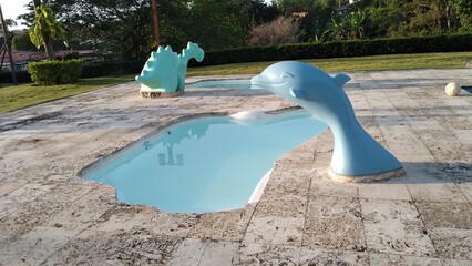 toddler pools with decorative animals © cristhian