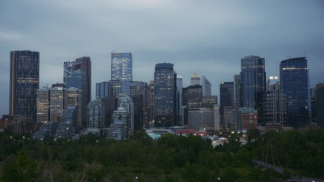 Evening timelapse of Calgary downtown cityscape. Day to night transition. 