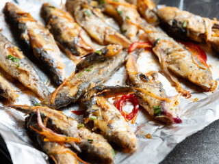 Seasoned fish on the grill	