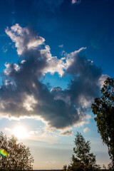 Ring shaped cloud on blue sky, vertical view