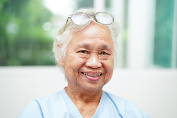 Fototapeta na wymiar Asian senior woman wearing eyeglasses or vision glasses at home care service.