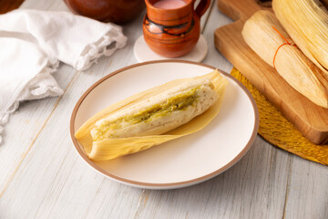 Tamales. Prehispanic dish typical of Mexico and some Latin American countries. Corn dough wrapped in corn leaves. The tamales are steamed.