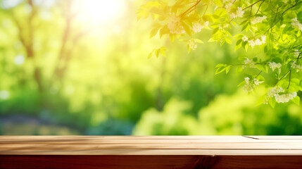 wooden tabletop against a background of green trees. daytime sunlight, beautiful spring sunny atmosphere