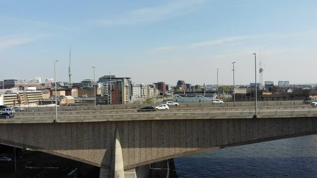 Busy Car Traffic On City Central Bridge, over Clyde River in Glasgow United Kingdom, Aerial 4K