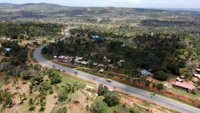 Aerial view drone flying over highway in palm oil plantation field