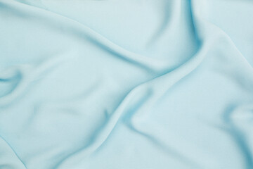 Empty waving blue fabric background, blank blue fabric texture background