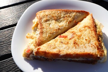 Street style masala bread omelet sandwich. Freshly cooked eggs with onion, tomatoes, and spices. Copy space. Healthy Morning breakfast ideas. Protein rich egg recipes.  