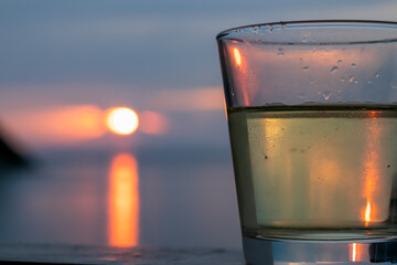 Drinking wine on balcony in luxury hotel in Fiesa with scenic view on idyllic coastline of Gulf of...