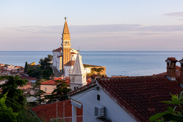 Panoramic aerial view at sunrise of coastal town Piran, Primorska, Slovenia, Europe. Shimmering...