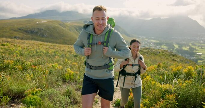 Happy friends walking, hiking on mountain and travel for fitness, adventure and journey in eco friendly wellness. Young people trekking in backpack on a path, green hill or nature for cardio health