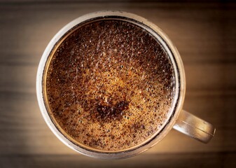 A cup of black coffee seen from above