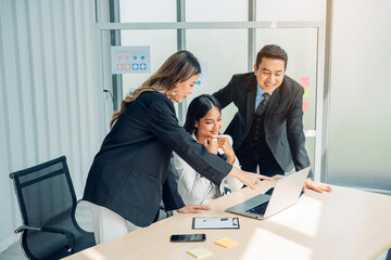 Male mature caucasian ceo businessman leader with diverse coworkers team, executive managers group at meeting. Multicultural professional businesspeople working together on research plan in boardroom.