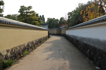 White walls and autumn leaves at Koko-en Garden in the early morning, Himeji, Japan