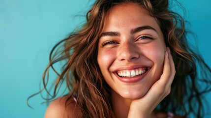 A close-up showcasing the confident smile of young woman with pristine teeth.