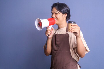 Young barista speak loudly using megaphones announces coffee discount while showing coffee cup