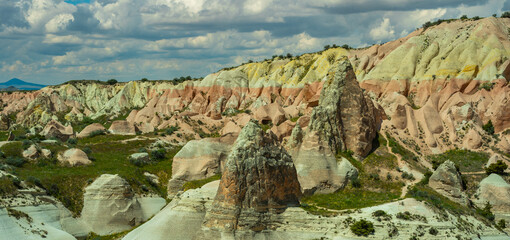 Martian landscape in Cappadocia, unique relief of mountains painted in yellow and pink colors