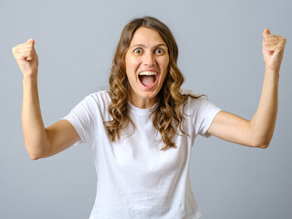Cheerful and excited girl feel luck, triumphing isolated