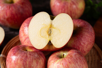  Close up of fresh red apples cuts fruit on table.