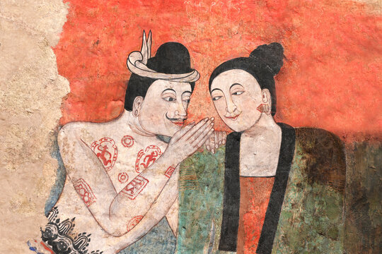 Nan Province, Thailand- December 22 20123: Mural painting at Wat Phumin, men and women whisper for love. Ancient paintings in Thailand