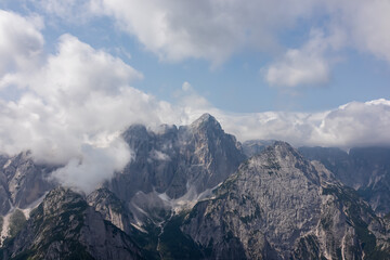 Scenic view of mountain peak Jof Fuart in untamed Julian Alps seen from summit Cima del Cacciatore, Monte Santo di Lussari, Friuli-Venezia Giulia, Italy. Wanderlust in remote Italian Alps in summer