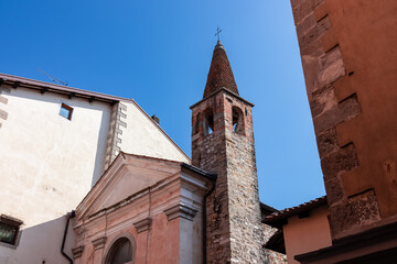 Stroll along narrow urban street that meanders towards magnificent church Chiesa di Santa Maria di...