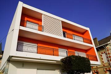 retro orange white contemporary residential new building with terrace balcony from fifties design in france - obrazy, fototapety, plakaty