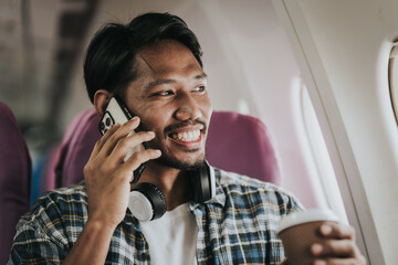 Asian male tourist enjoying airplane travel, traveling around the world on his own.