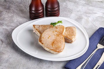 Roasted red tuna steak in the plate