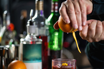 Bartender Enhances Negroni Cocktail with Orange Peel