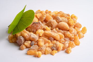 Frankincense or olibanum aromatic resin isolated on white background used in incense and perfumes.