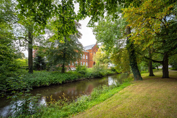 Herbartgymnasium Oldenburg with Hausbäcke river and forest in foreground, Oldenburg, Germany