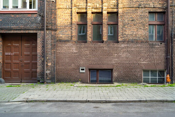 old vintage damaged building  facade , Polish brickwall facade entrance  © eric