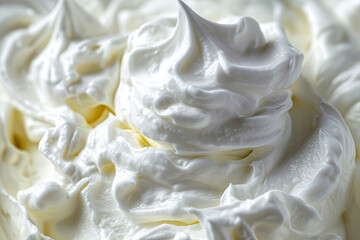 Close up of white whipped cream swirl texture for background and design.
