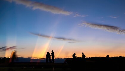 Fototapeta na wymiar Long exposure to twilight sky and people's silhouette
