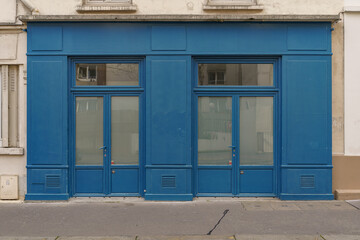 Fototapeta na wymiar old vintage blue storefront facade , european hipster boutique entrance , commercial vitrine template