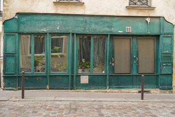 old vintage green storefront facade , european hipster boutique entrance , commercial  vitrine...