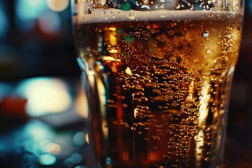 Poster A close-up shot of a glass of beer on a table. Perfect for advertising or socializing themes © Fotograf