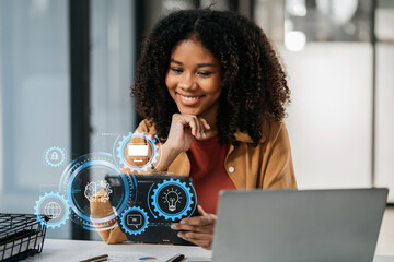 Learning online working concept. Businesswoman working on tablet and laptop computer, searching working in office.